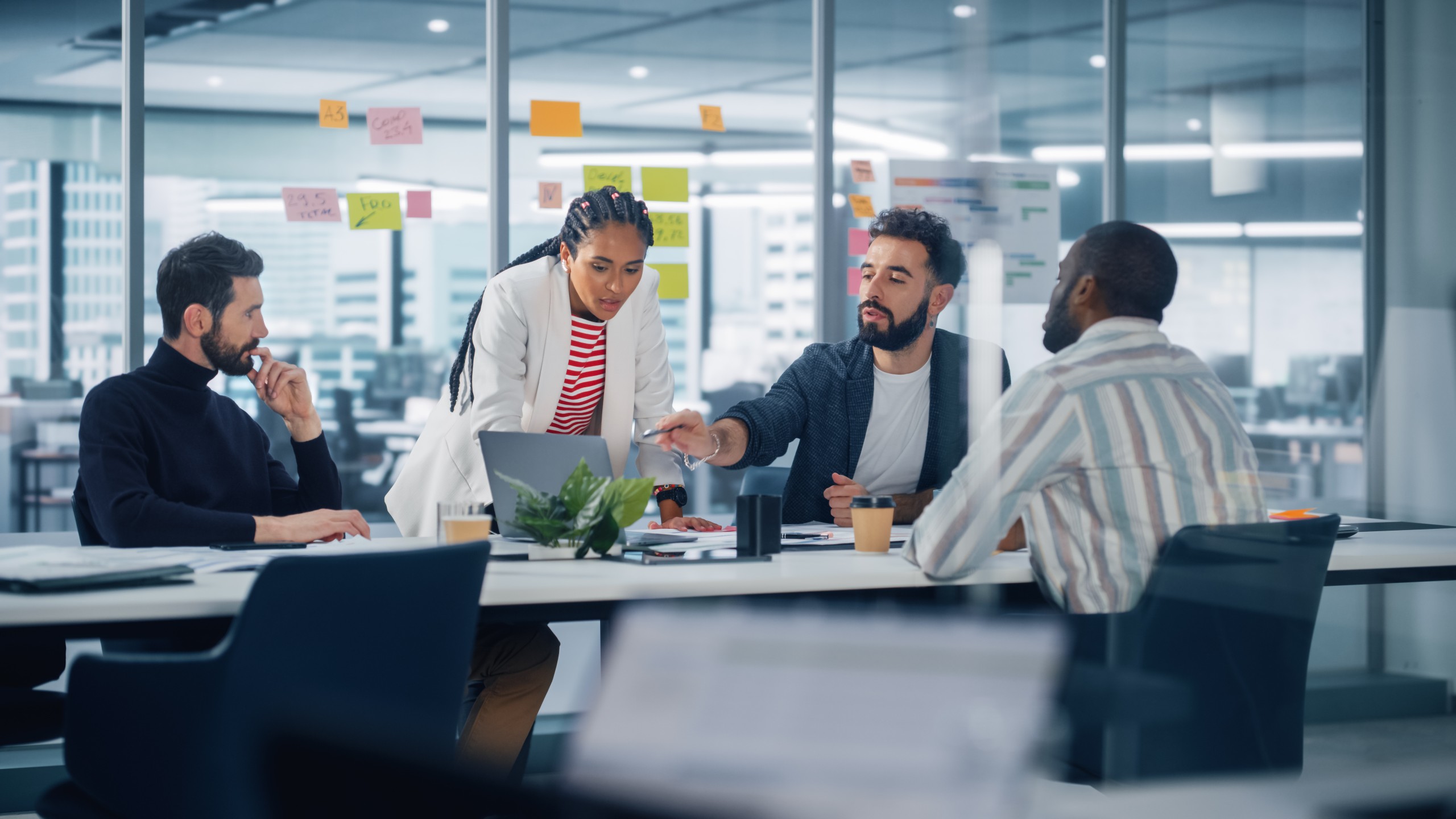 Diverse Modern Office: Successful Motivated Black Businesswoman Leads Meeting, talks of Company Growth. Digital Entrepreneurs Work on e-Commerce Project. Multi-Ethnic Creatives Brainstorm Strategy